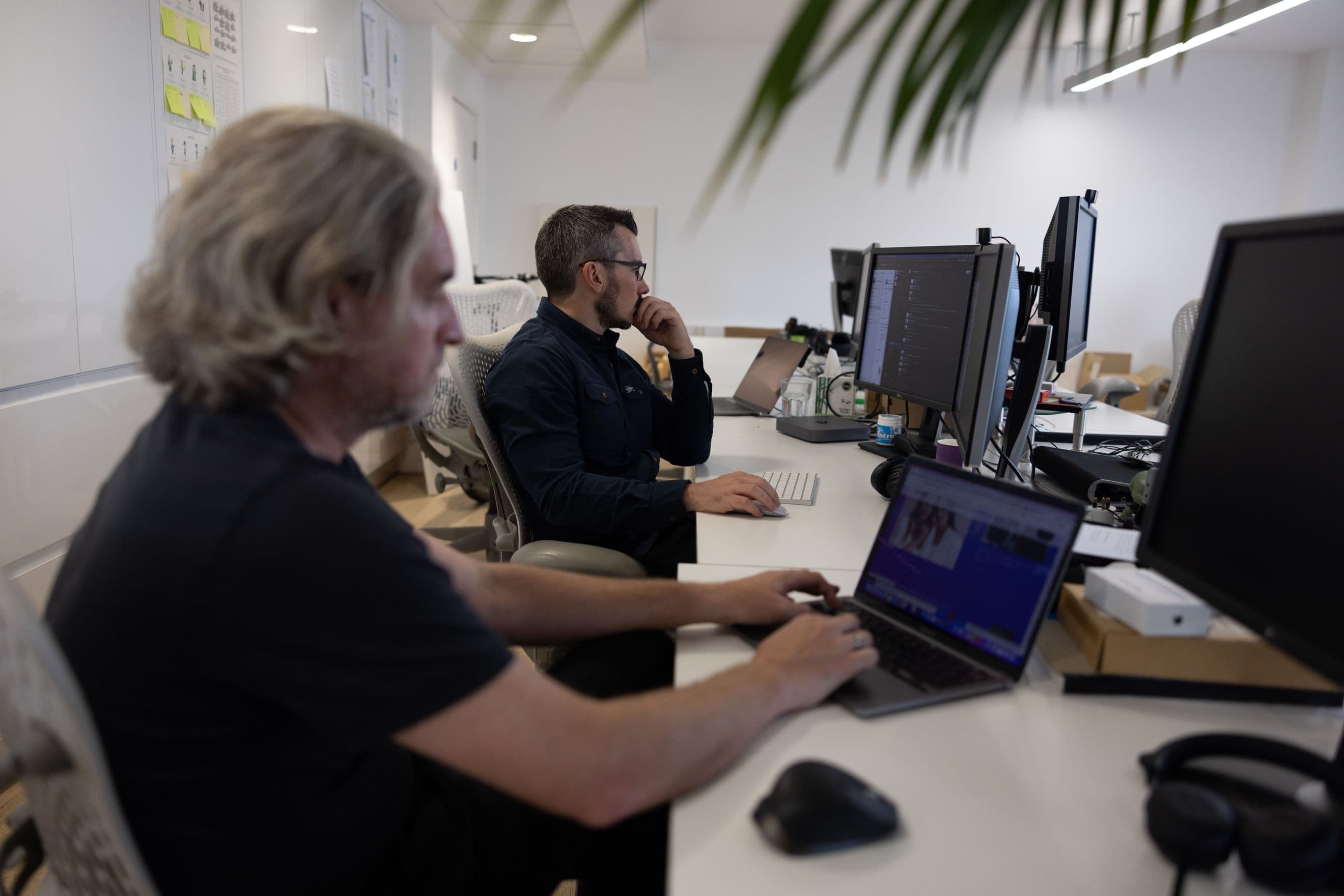 Two developers working on some Adobe Commerce agency work for Unified