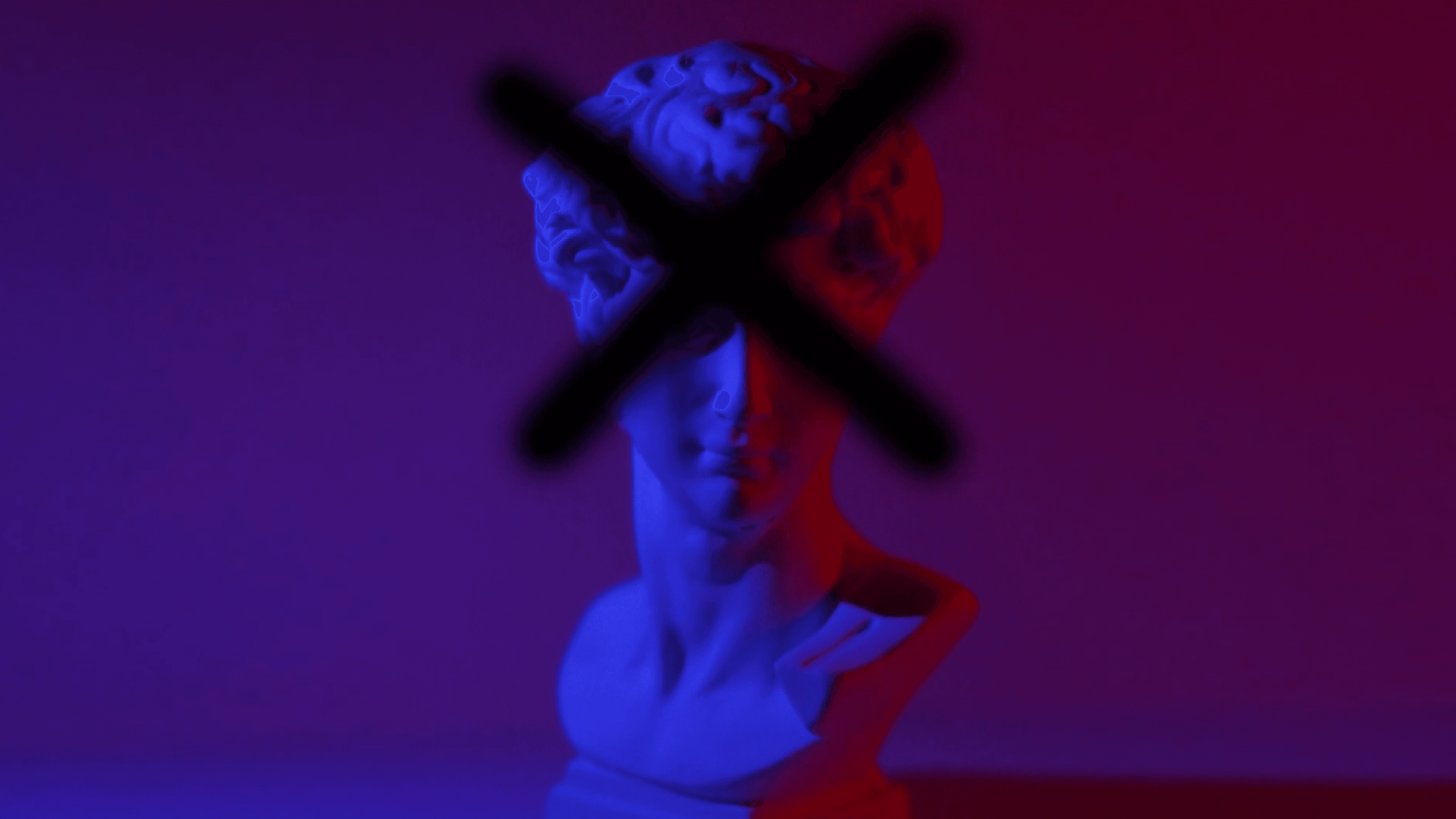 A statue bust with an x graffitied over it, signifying headless cms.